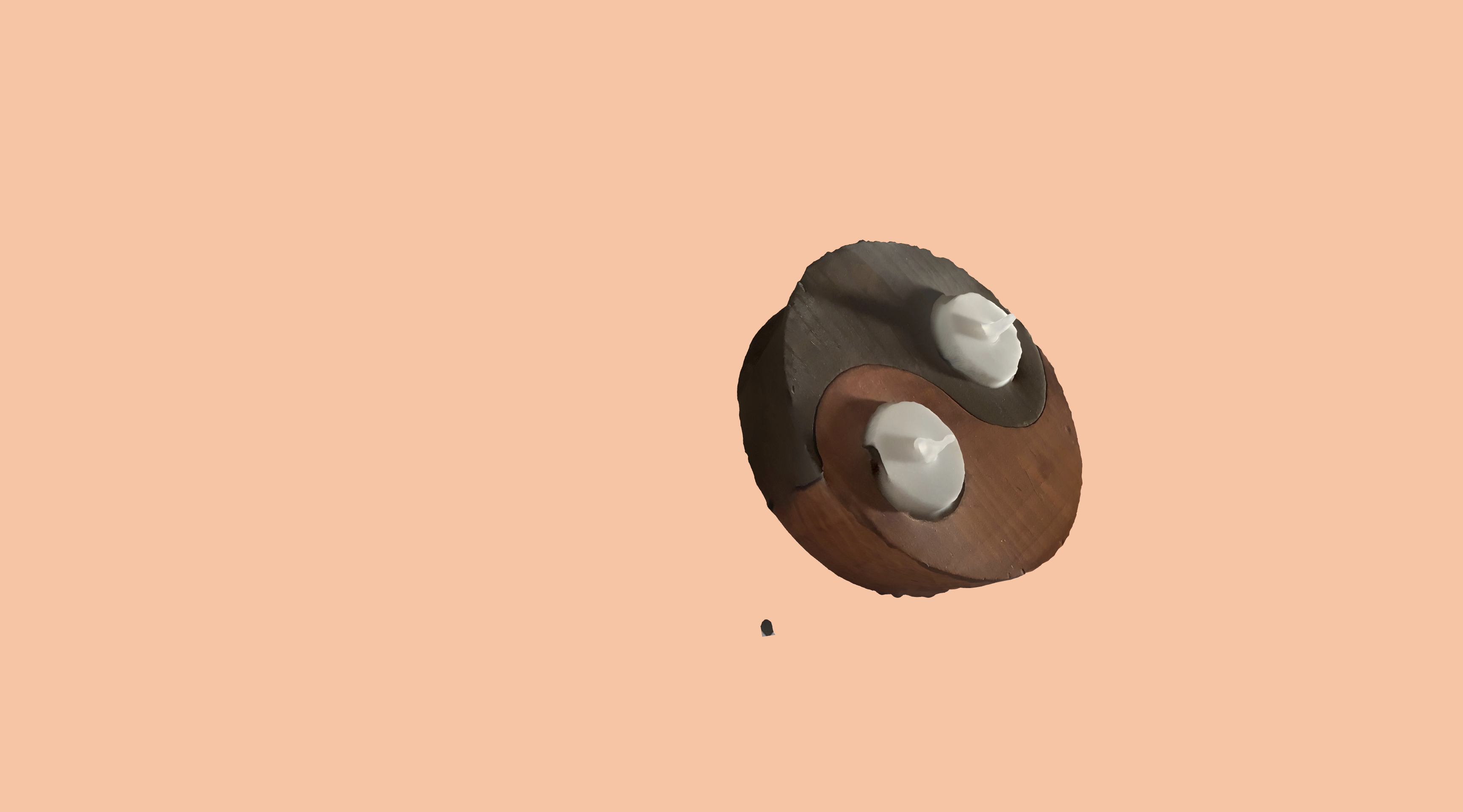 The candle 3D model on the live site with a light peach background.
