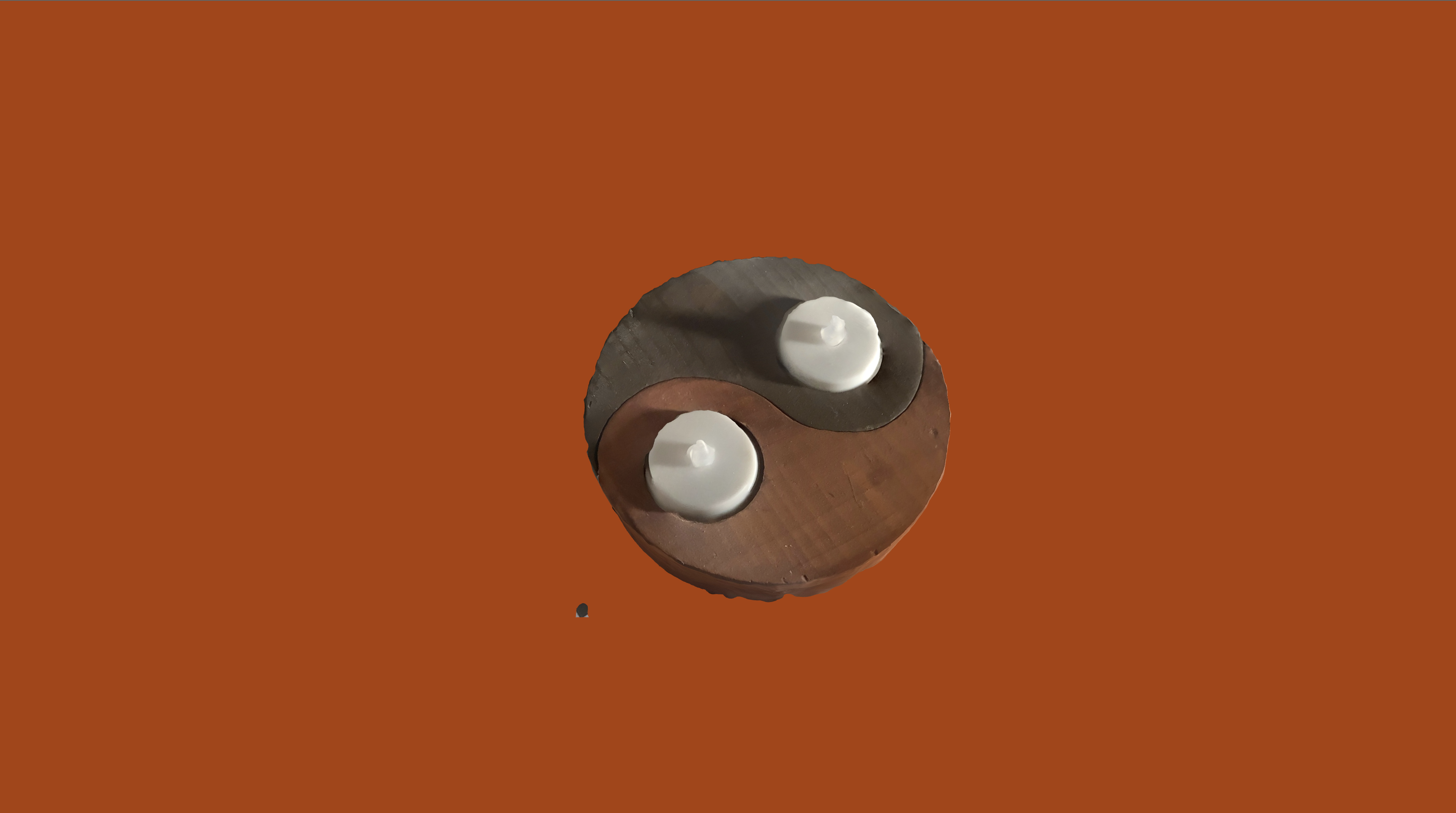 The candle 3D model on the live site with a deep orange background.